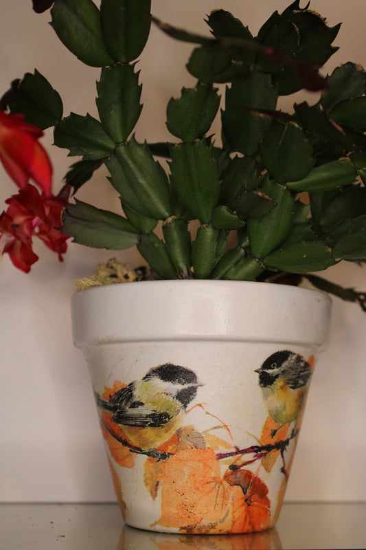 Decoupage terracotta plant pot