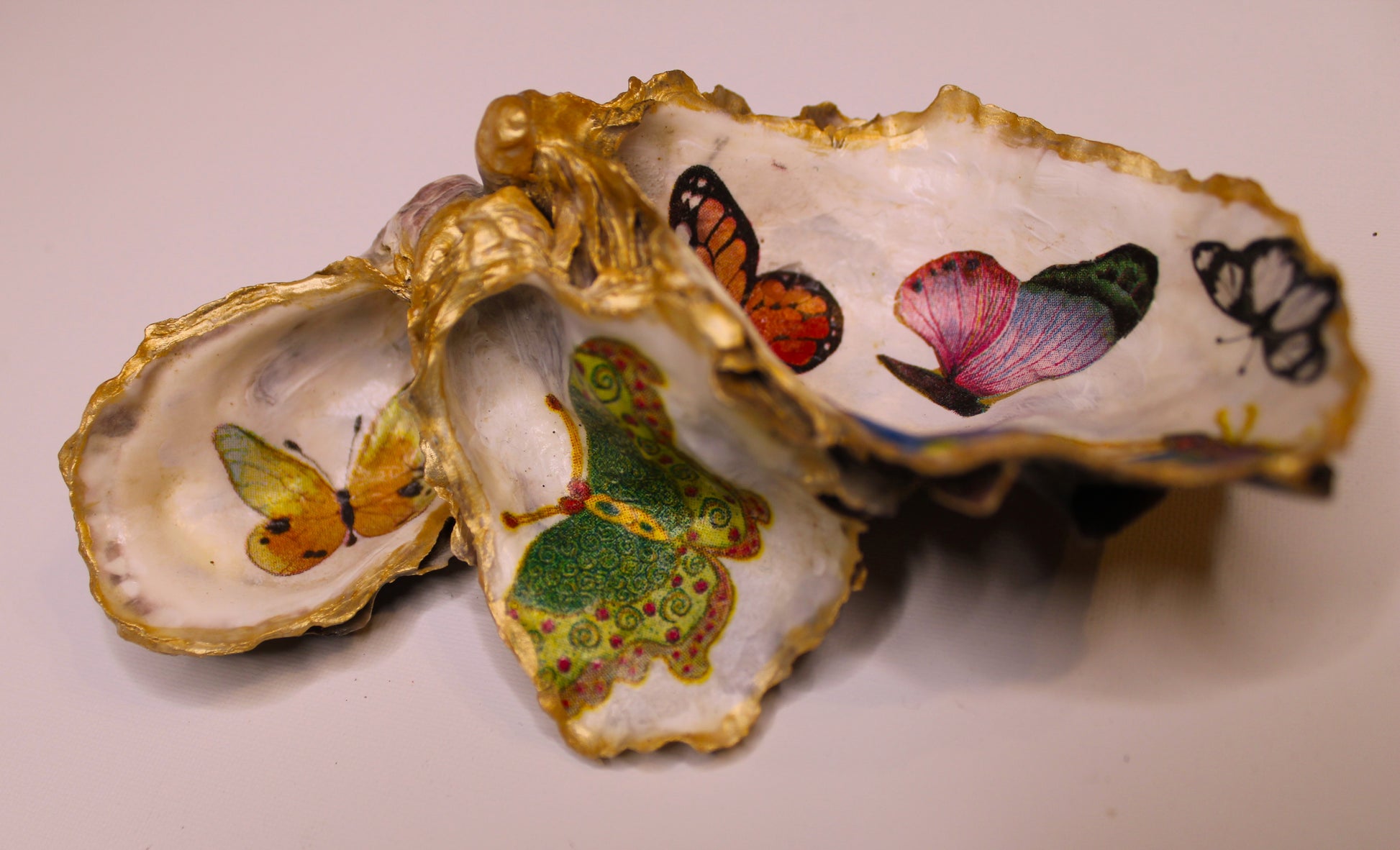 beautiful 3 part oyster shell. decoupage with butterflies and edged with gold paint.