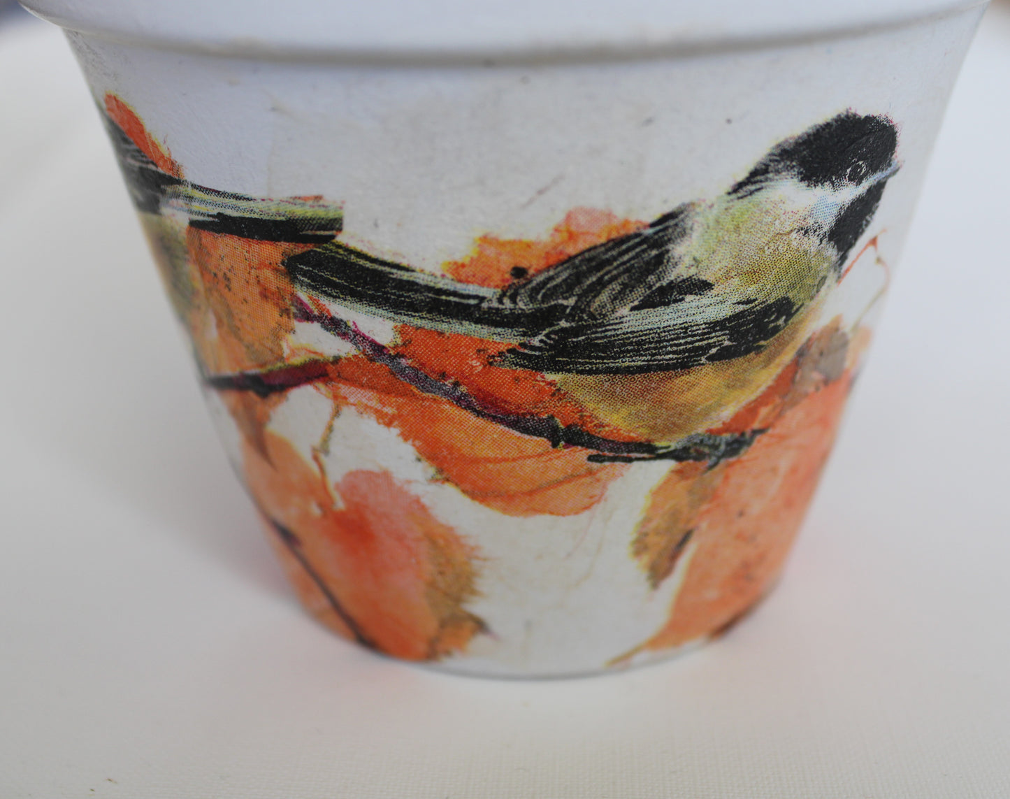 Decoupage terracotta plant pot